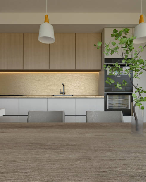 istock A modern kitchen featuring sleek cabinetry, stylish lighting, and a touch of greenery, creating an inviting and contemporary atmosphere. 3d rendering. 2195198337