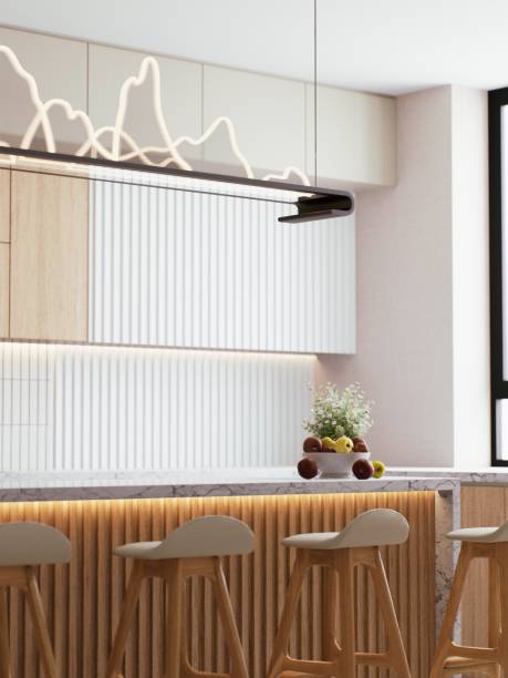 istock A modern kitchen design featuring sleek cabinetry, a minimalist island, stylish bar stools, and a bright, airy atmosphere. 3d rendering. 2195198387