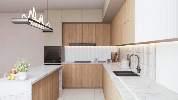 istock A modern kitchen featuring sleek cabinetry, marble countertops, and stylish lighting, creating a warm and inviting culinary space. 3d rendering. 2195198552