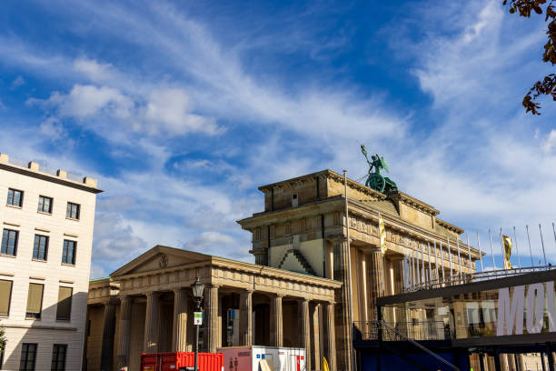 Berlin, Germany - September 14, 2024: Brandenburg Gate with blue sky and clouds, Berlin.