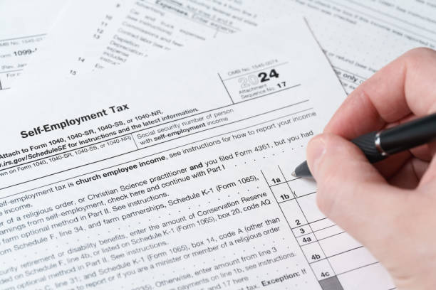 istock Schedule SE, Self-Employment Tax Form 1040, IRS Tax Document Close-Up 2195199414
