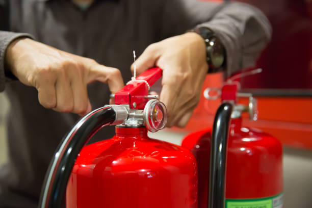 istock Engineer are inspection check fire extinguisher for emergency rescue and safety training concept. 2195200125