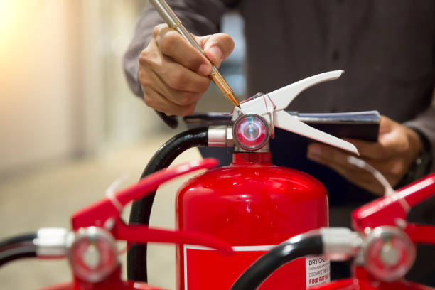 istock Engineer are inspection check fire extinguisher for emergency rescue and safety training concept. 2195200126