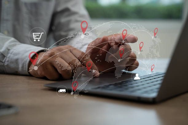 istock Logistic import export  man is using a laptop with a map of the world on the screen Logistics and transportation software 2195202205