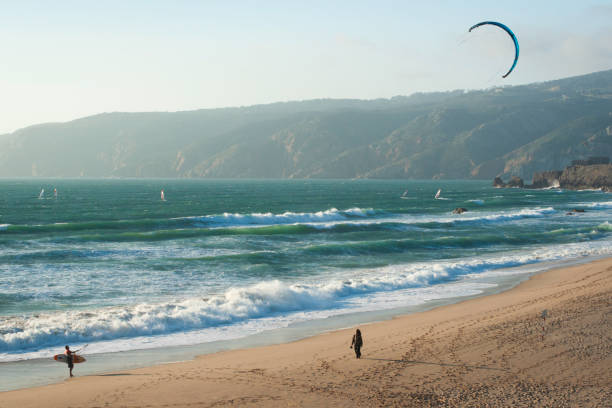 Sintra; Portugal - June 16, 2010: Locals kite surfing on a windy summer day