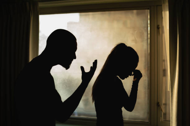 istock Domestic violence. Husband yelling at wife, people relationship conflict problems difficulties 2195204832