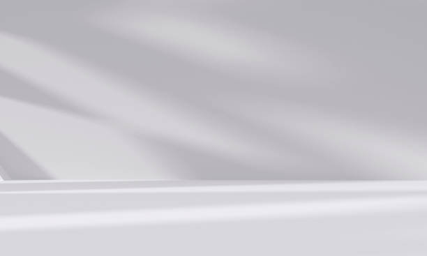 istock abstract white studio room with light and shadow from window background for product display presentation 2195206795
