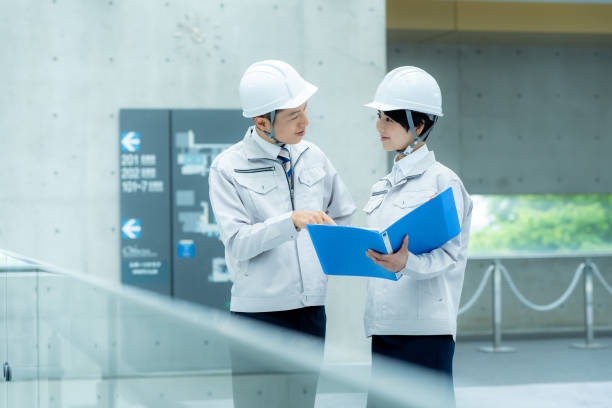 istock Businessmen in work clothes having a meeting 2195208224