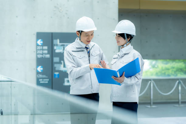 istock Businessmen in work clothes having a meeting 2195208225