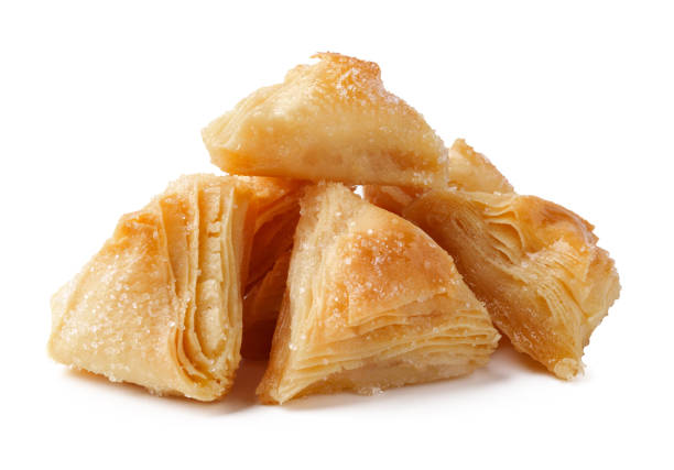 istock Sweet and flaky baklava pieces arranged beautifully on a white background 2195209705