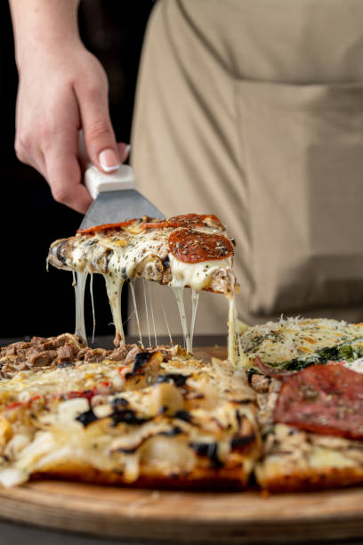 istock Assorted handmade Argentinian pizza on wooden background 2195209848