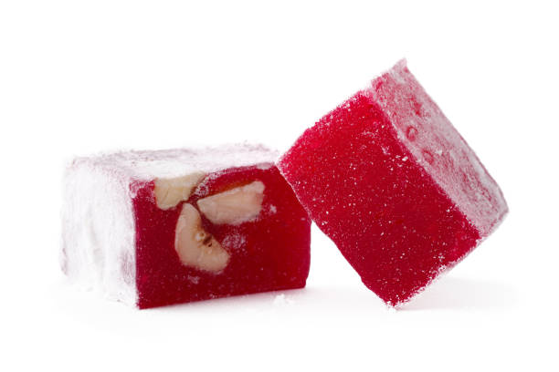 istock Ruby red jelly cubes with nuts on a white background showcasing a colorful dessert treat 2195209987