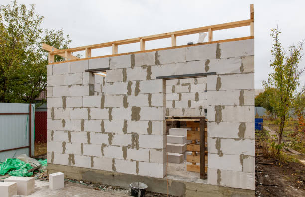 istock A building under construction with a cement wall and a wooden roof 2195209991