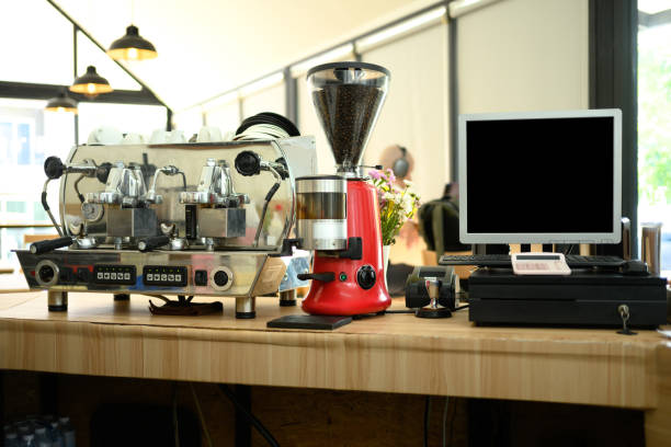 istock Coffee machine and grinder on a wooden countertop in a modern cafe 2195212089