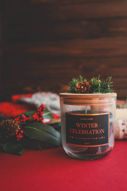 A festive glass candle labeled 
