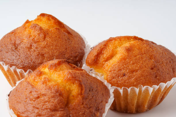 istock Freshly baked muffins arranged on a white surface ready for serving during a morning gathering 2195212189