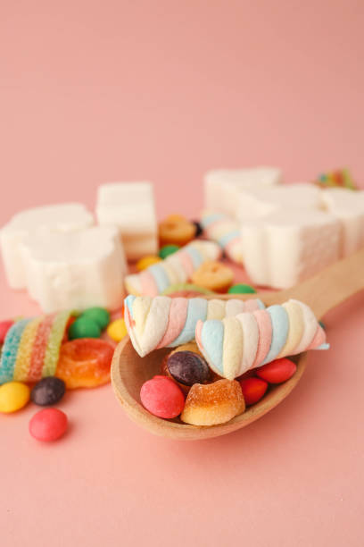 istock Assortment of sweets on a soft pink background, banner, advertising 2195212244