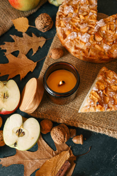 istock Candle and homemade apple pie, autumn mood 2195212328