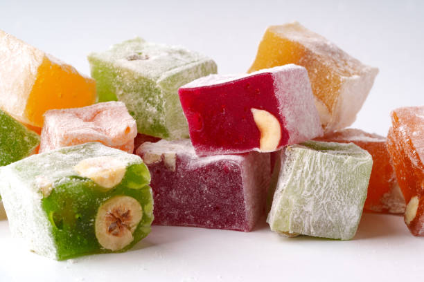 istock Colorful assortment of traditional Turkish delight with nuts displayed on a white background 2195212395