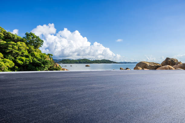 Asphalt road and beautiful coastline nature landscape under blue sky