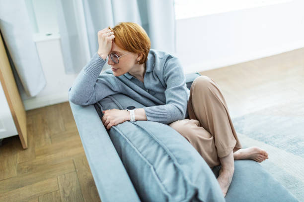 istock Mid adult woman with depression 2195215493