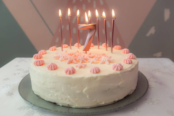Birthday cake with pink decoration for 7 years for design purpose