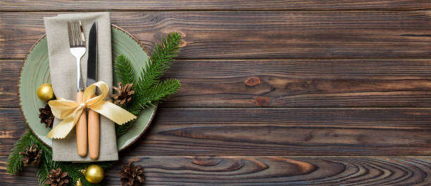 istock Christmas table place setting with christmas decor and plates, kine, fork and spoon. Christmas holiday background. Top view with copy space 2195222811