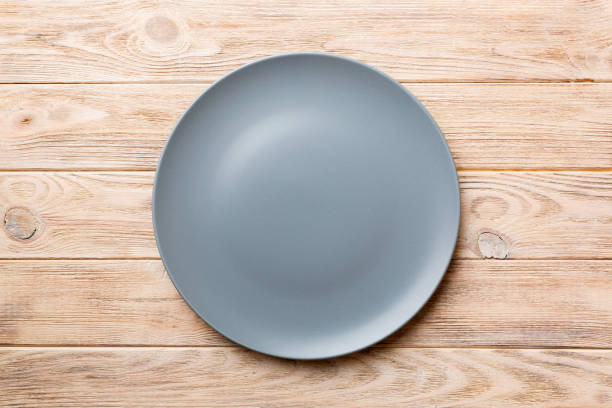 istock Top view of empty grey plate on wooden background. Empty space for your design 2195222854