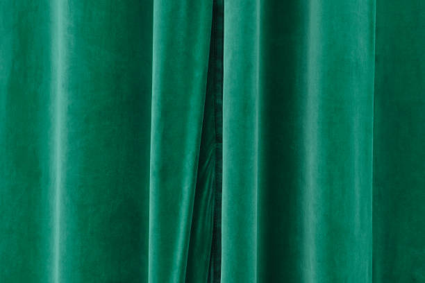 istock Closed green velvet stage curtain. 2195223196