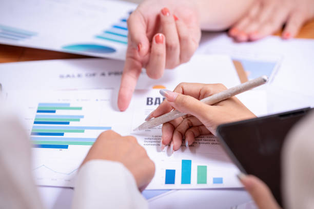 istock People's hands working with papers at meeting discussions shows successful teamwork. 2195223549