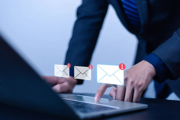 istock New email notification concept for business email communication. Businessman touching email on virtual screen. Internet technology. Mailbox receives electronic message notification. 2195225248