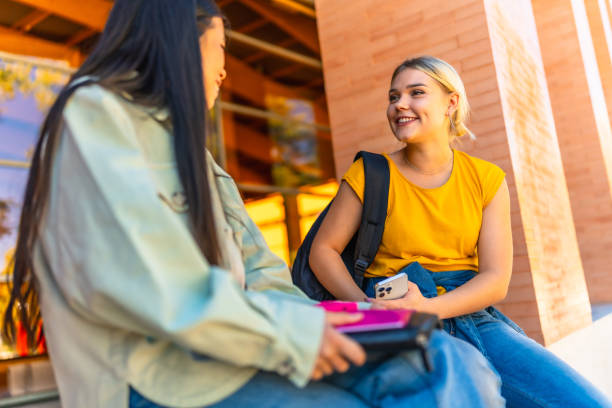 istock Exchange students talking outside the university building 2195230858