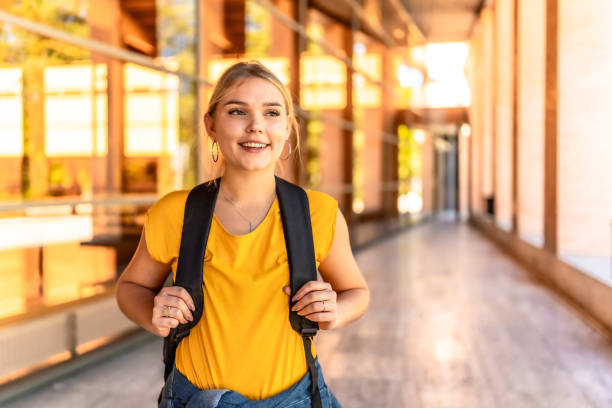 istock Happy blonde student standing at the university 2195230955