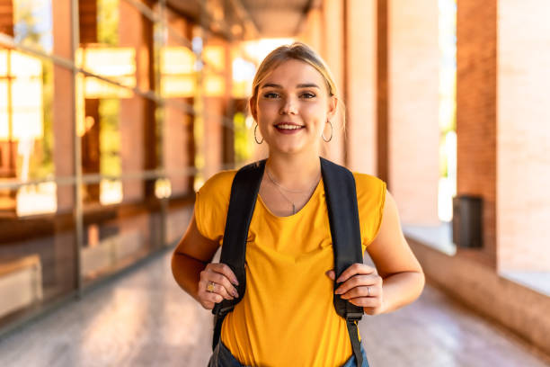 istock Portrait of blonde university student smiling at camera 2195230956