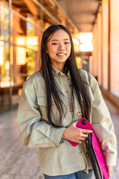 istock Happy chinese woman at the university campus 2195230968