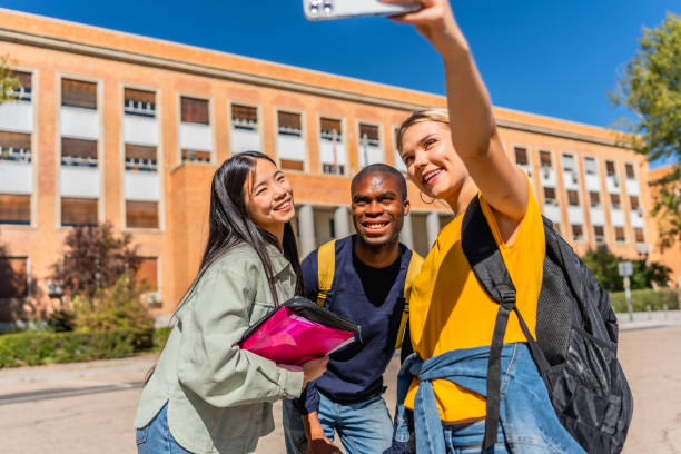 istock Happy multi-ethnic students taking selfie outside the university 2195231019