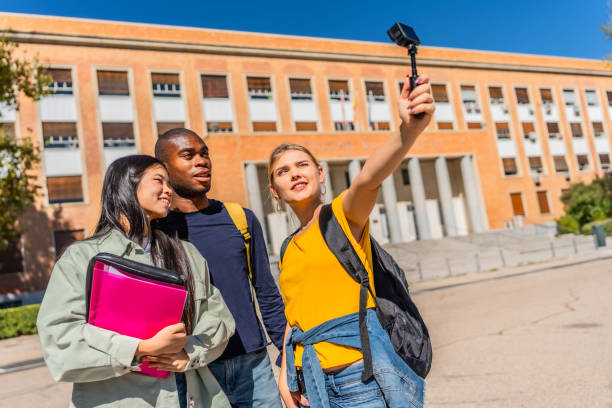 istock Student taking selfie with portable digital camera in the campus 2195231031