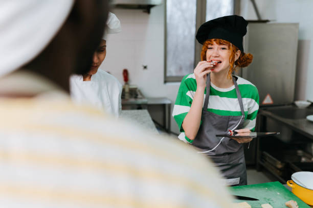 istock Chef assisting members of a cooking class 2195232853