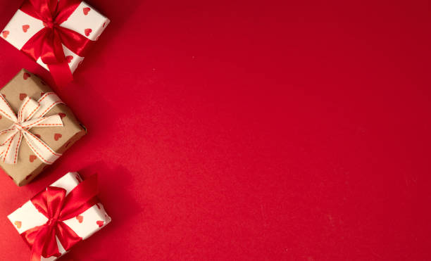istock Gift boxes top view on red empty space background, valentine's backdrop, Christmas banner,presents. 2195233246