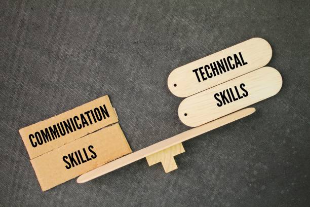 istock balance between the words communication skills vs technical skills. emphasis on communication skills. 2195233961