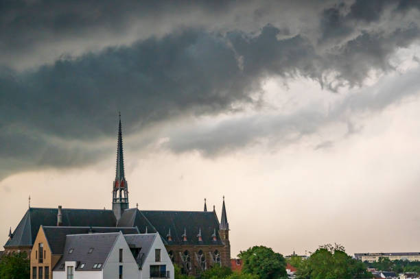 Storm clouds over Zwolle during a summer thunderstrom at the end of a warm and humid summer afternoon. A shelf cloud is approaching over the rooftops and the Dominicanenklooster.