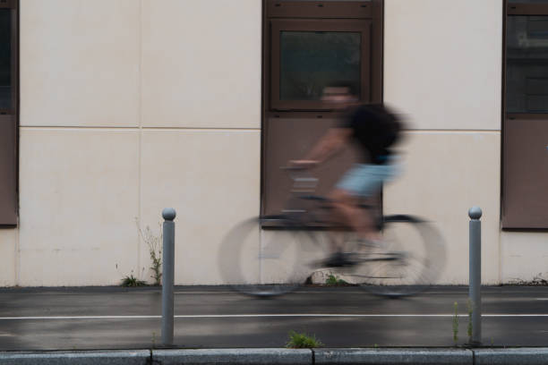 Biker on the cycling way of the sustainable Bordeaux city downtown