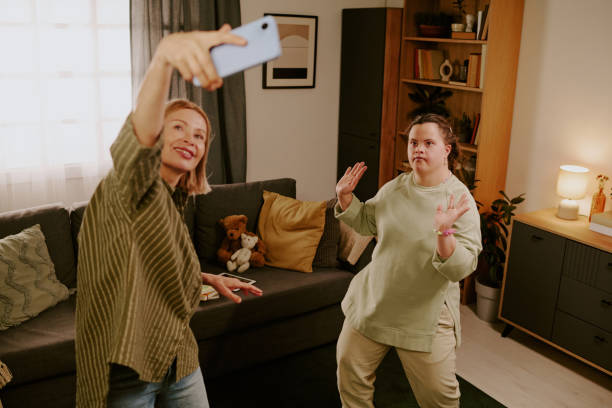 istock Mom And Her Daughter With Disability Having Fun At Home 2195239629