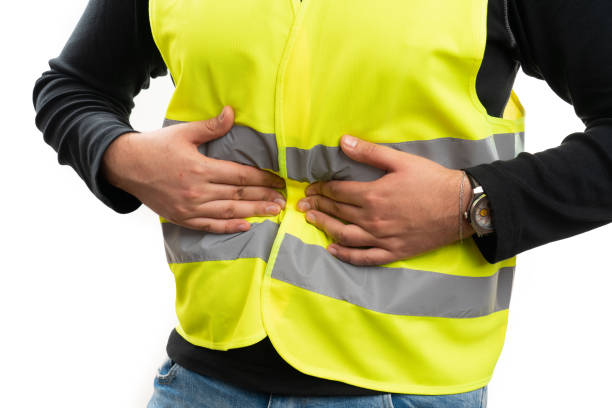 istock Close-up of constructor having indigestion touching belly 2195240024