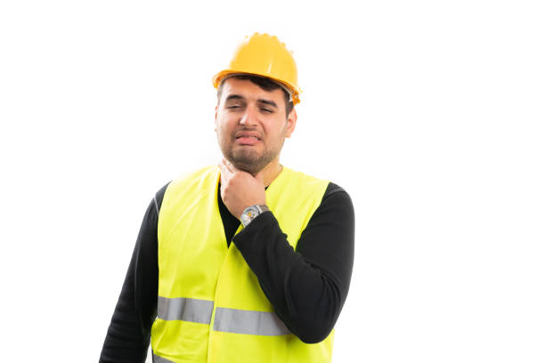 istock Male builder in work equipment with cold symptoms sore throat 2195240262