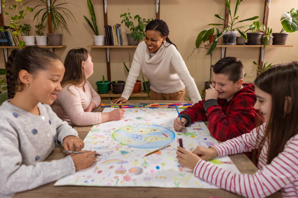 istock Diverse Kids Collaborate on Earth Day Drawing 2195242368