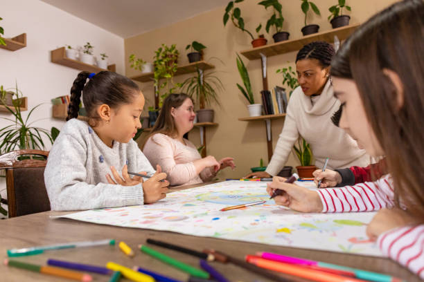 istock Schoolchildren Creating Colorful Earth Poster 2195242734