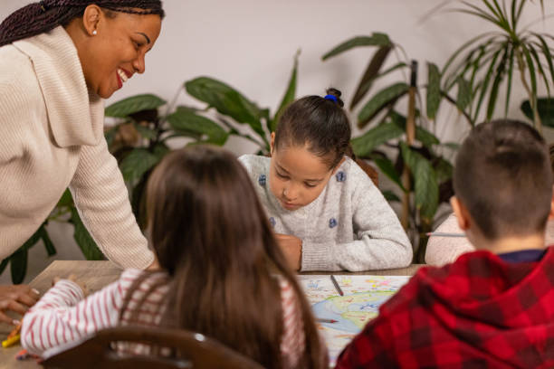 istock Teacher Encourages Young Artists 2195243408