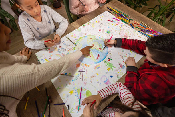 istock Children Drawing for the Planet 2195244523