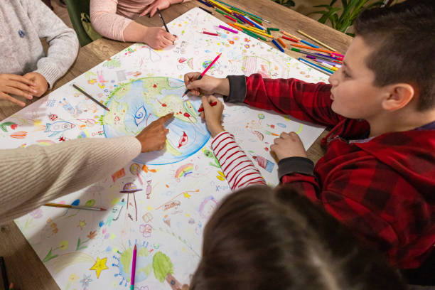 istock Teacher Guides Kids in Earth Day Art 2195244793